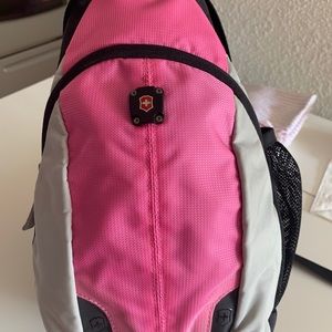 Victorinox black and pink cross body bag.